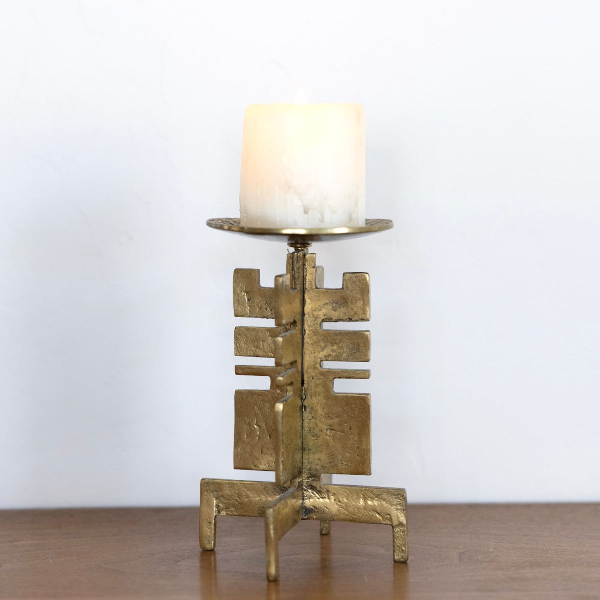 Sculptural brass candle holder