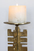 Sculptural brass candle holder